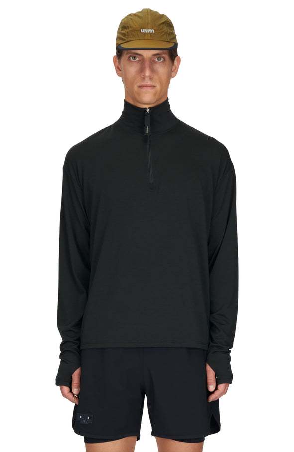 Men's black long sleeve running wool layer with half-zip and thumbholes.